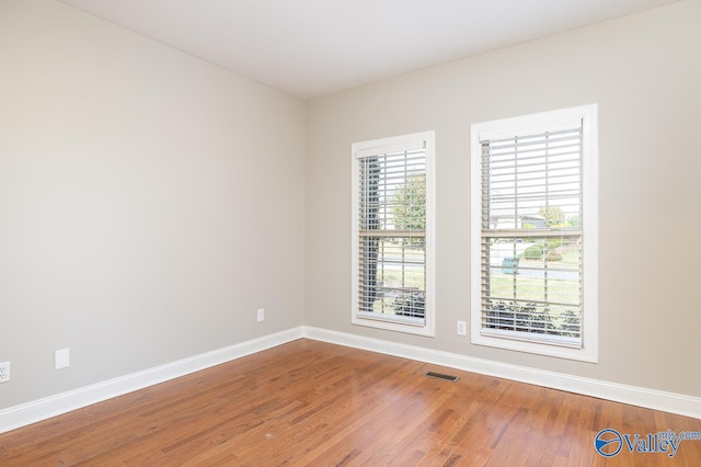 empty room featuring hardwood / wood-style floors