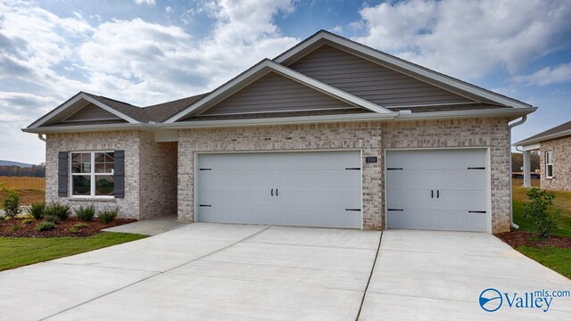 view of front of house with a garage and a front yard