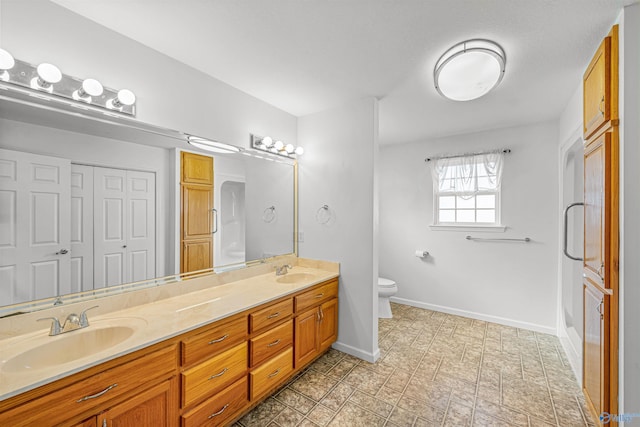 bathroom with vanity and toilet