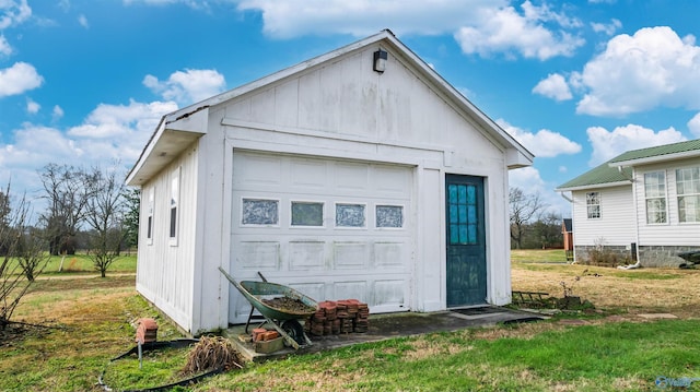 garage featuring a lawn