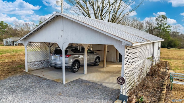 view of vehicle parking featuring a carport