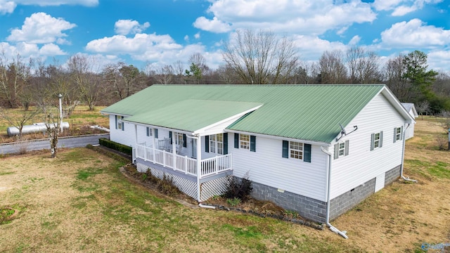 exterior space with a porch and a yard