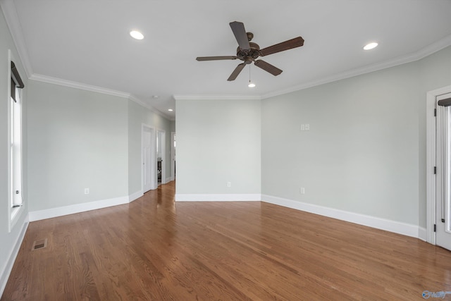 spare room with baseboards, ornamental molding, recessed lighting, a ceiling fan, and visible vents