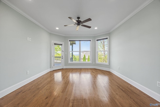 spare room with baseboards, ceiling fan, crown molding, recessed lighting, and wood finished floors