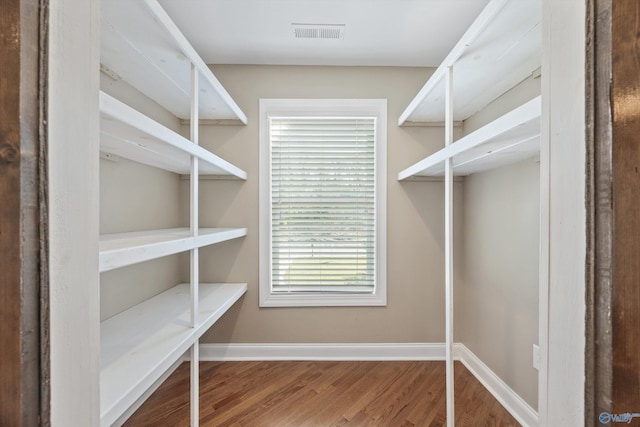 interior space featuring wood finished floors and visible vents