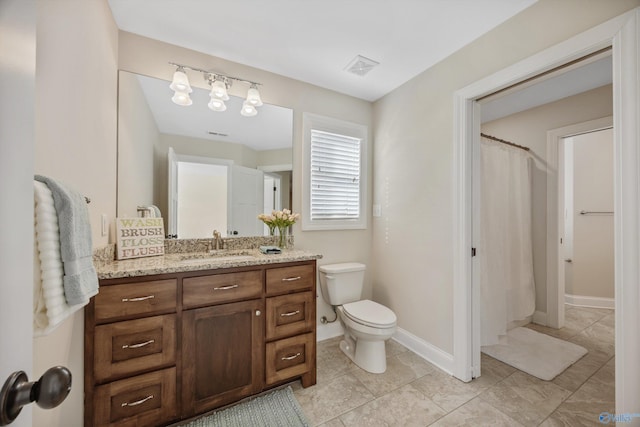 full bathroom featuring vanity, tile patterned flooring, visible vents, toilet, and baseboards