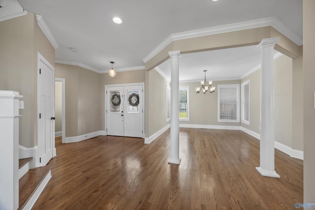 entryway with baseboards, decorative columns, a notable chandelier, and wood finished floors