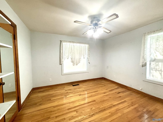 312 8th Ave SW, Attalla, AL 35954 - unfurnished room with healthy amount of natural light, light wood finished floors, a ceiling fan, and baseboards