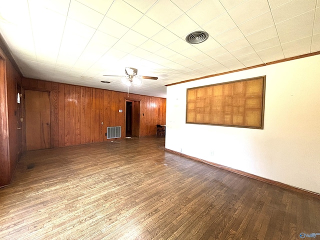 312 8th Ave SW, Attalla, AL 35954 - empty room featuring wood finished floors, baseboards, a ceiling fan, and wooden walls