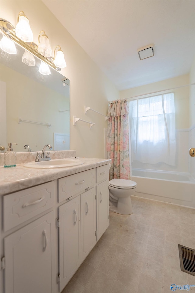 bathroom with toilet, visible vents, shower / bath combo, and vanity