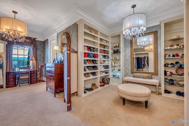 spacious closet with an inviting chandelier and carpet floors