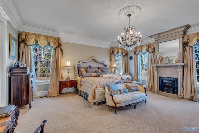 carpeted bedroom featuring a tiled fireplace, a notable chandelier, and crown molding