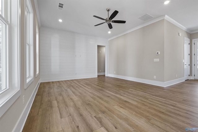 unfurnished room with light hardwood / wood-style flooring, ceiling fan, and ornamental molding