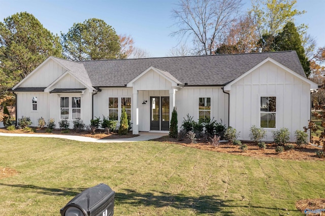 modern inspired farmhouse with a front yard