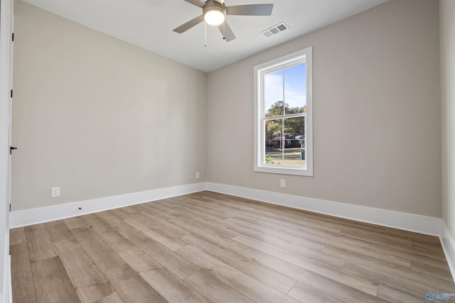 unfurnished room featuring ceiling fan and light wood-type flooring