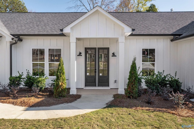 view of exterior entry featuring a yard