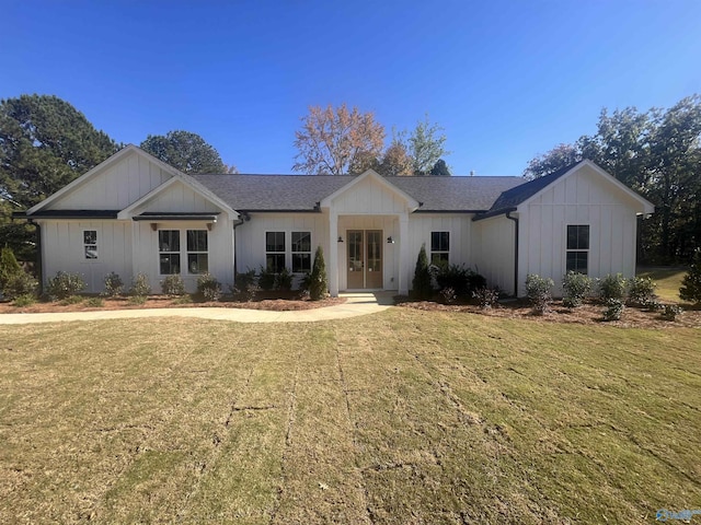 view of front of home with french doors and a front yard