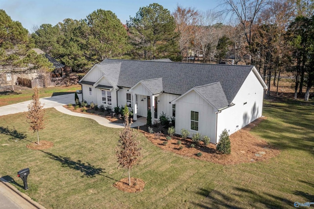 modern farmhouse with a front lawn