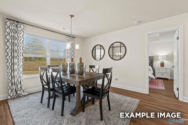 152 Rose Valley Dr, New Market, AL 35761 - dining space featuring baseboards, an inviting chandelier, and wood finished floors