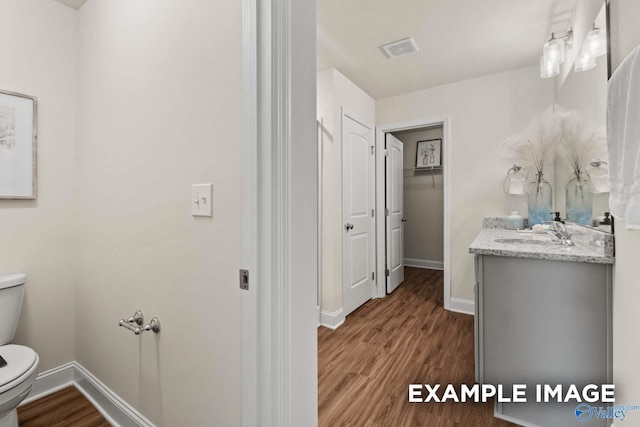 152 Rose Valley Dr, New Market, AL 35761 - bathroom with visible vents, toilet, baseboards, and wood finished floors