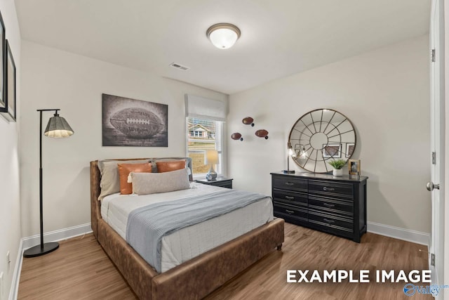 152 Rose Valley Dr, New Market, AL 35761 - bedroom featuring visible vents, baseboards, and wood finished floors