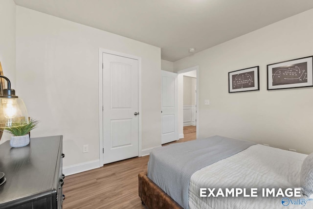 152 Rose Valley Dr, New Market, AL 35761 - bedroom featuring baseboards and wood finished floors