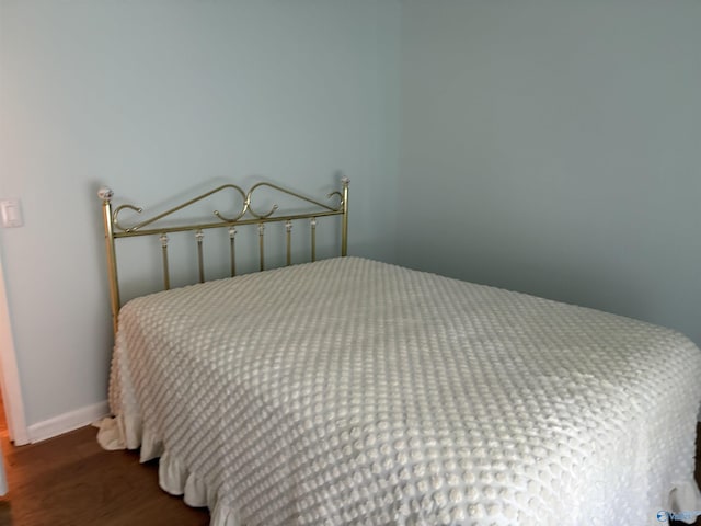 bedroom with wood finished floors