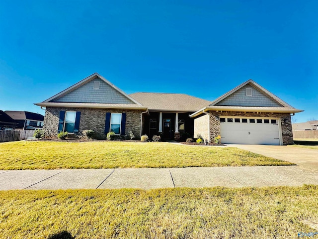 view of front of property with a front lawn and a garage