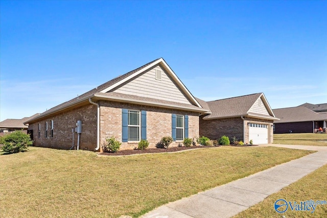 ranch-style home featuring a front yard and a garage