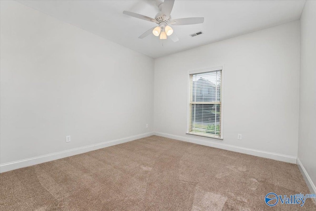 carpeted empty room with ceiling fan