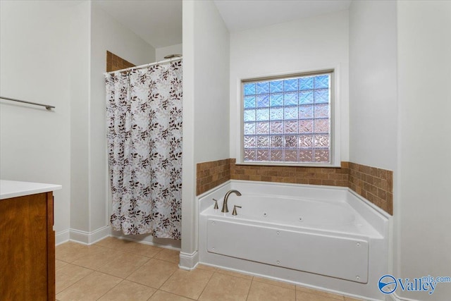 bathroom featuring vanity, tile patterned floors, and separate shower and tub