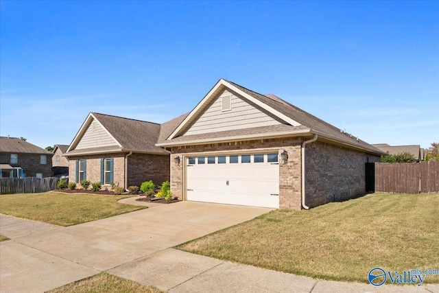 ranch-style home with a front lawn and a garage