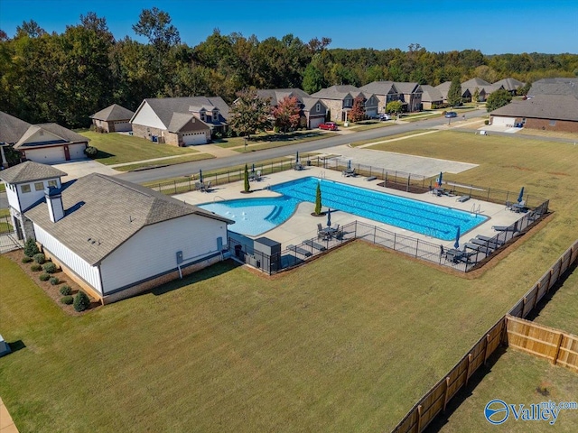 view of swimming pool featuring a patio area and a lawn