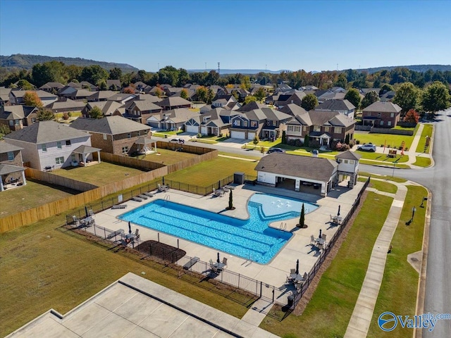 view of pool featuring a patio area and a yard