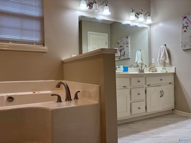 bathroom featuring vanity and a bath