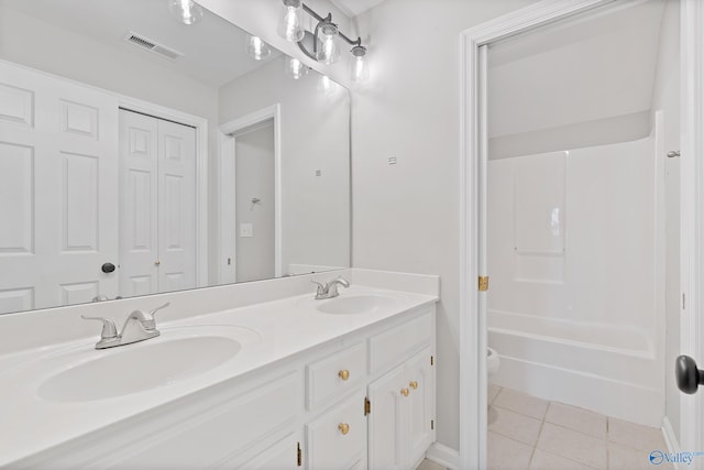 full bathroom with tile patterned flooring, vanity, toilet, and washtub / shower combination