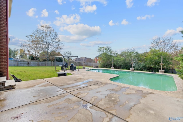 view of pool with a lawn, a pergola, and a patio