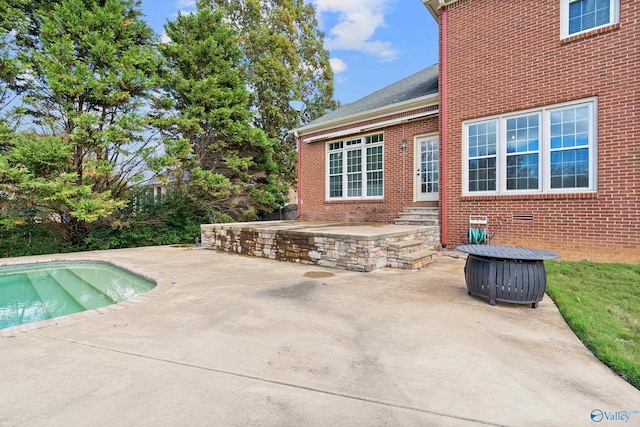 view of swimming pool with a patio area