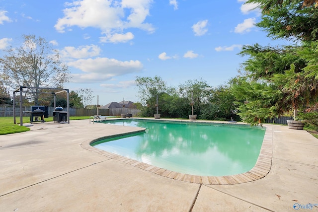 view of pool with a pergola and a patio area