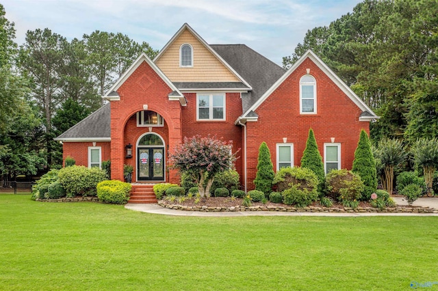 44 Audrey Ln, Gadsden, AL 35901 - traditional-style home with french doors, brick siding, and a front yard