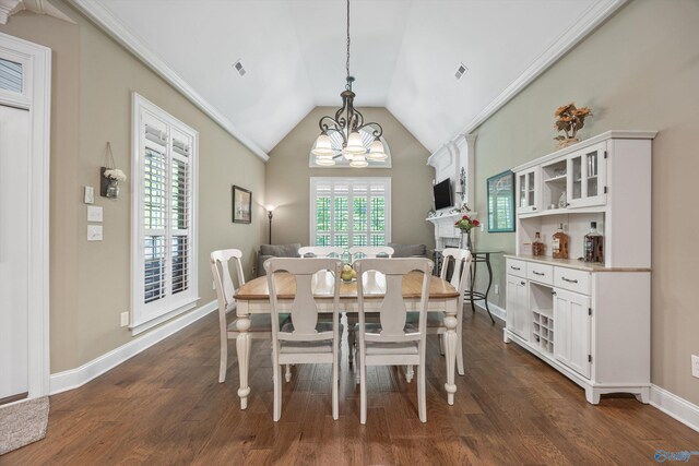 39 Verdant Cir, Huntsville, AL 35803 - dining room with dark wood-type flooring, a chandelier, and vaulted ceiling