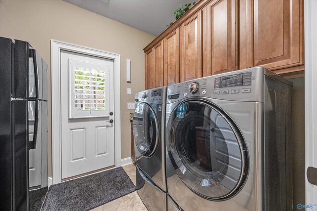 39 Verdant Cir, Huntsville, AL 35803 - laundry room featuring washer and dryer, cabinet space, and light tile patterned floors
