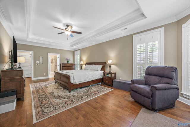 39 Verdant Cir, Huntsville, AL 35803 - bedroom featuring a raised ceiling, ornamental molding, wood-type flooring, and a ceiling fan