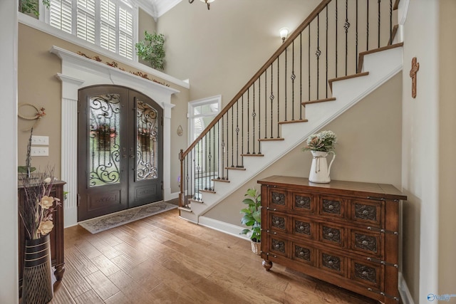 39 Verdant Cir, Huntsville, AL 35803 - entrance foyer featuring french doors, stairs, a towering ceiling, and wood finished floors