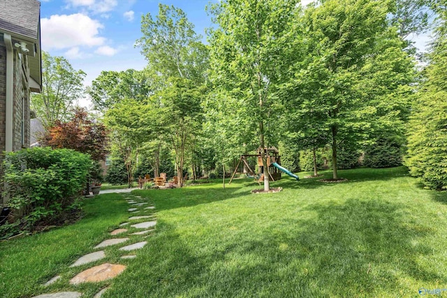 39 Verdant Cir, Huntsville, AL 35803 - view of green lawn featuring a playground