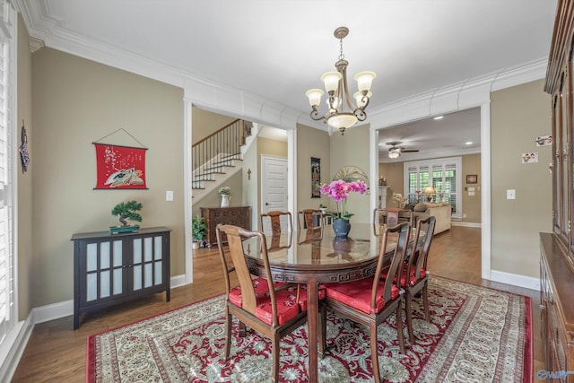 39 Verdant Cir, Huntsville, AL 35803 - dining room featuring ornamental molding, a chandelier, wood finished floors, a ceiling fan, and stairs