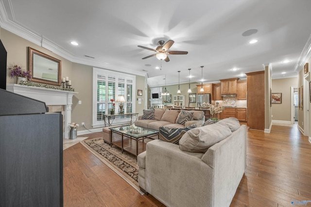39 Verdant Cir, Huntsville, AL 35803 - living room with ceiling fan, ornamental molding, hardwood / wood-style flooring, recessed lighting, and a fireplace with flush hearth