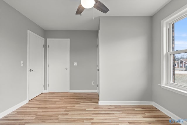 unfurnished room with ceiling fan and light hardwood / wood-style floors