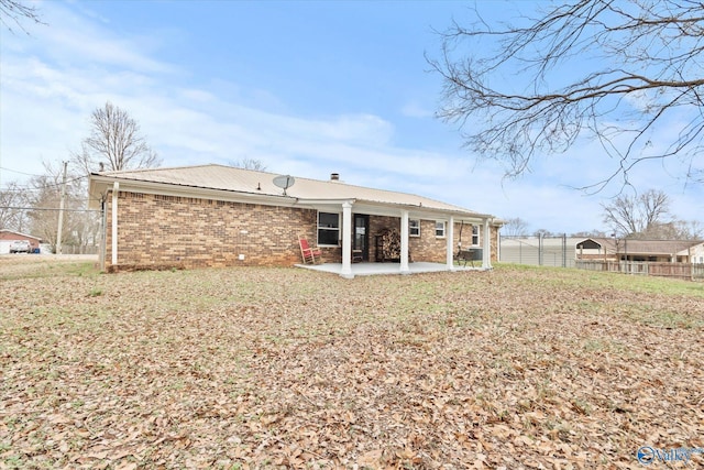 back of house with a patio area