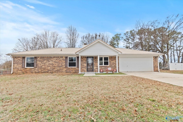 single story home with a front yard and a garage